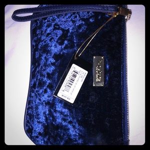 Navy blue BEBE wristlet
